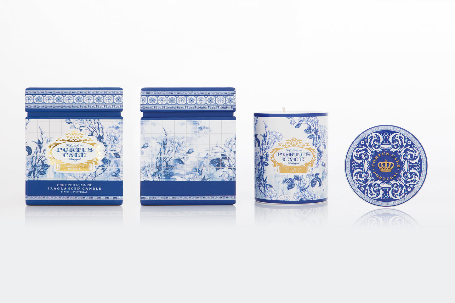 Set of candles with decorative blue and white packaging on a white background