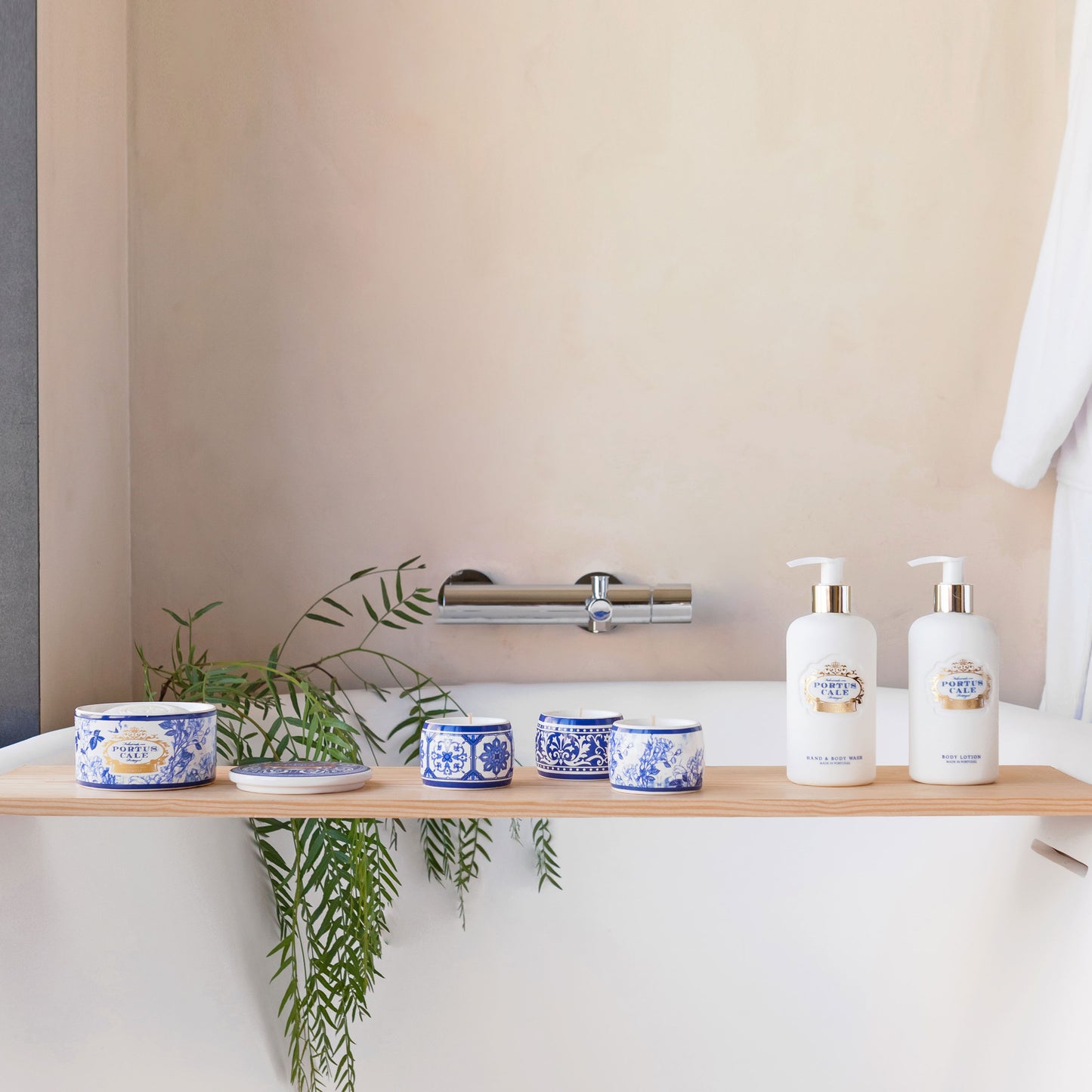 Bathroom shelf with toiletries and a plant against a beige wall.