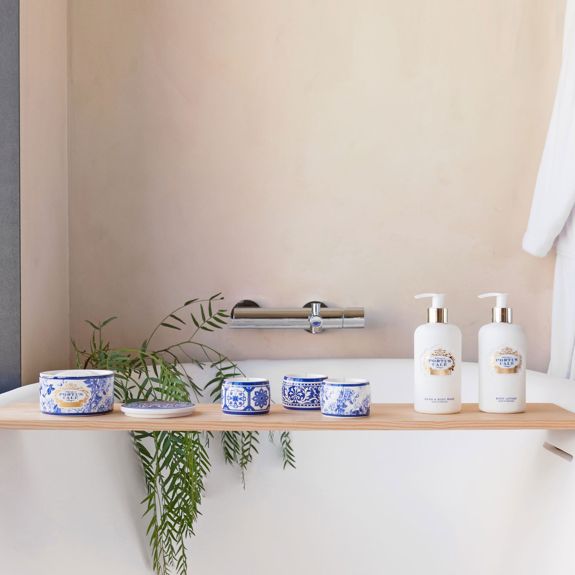 Bathroom shelf with toiletries and a plant against a beige wall.